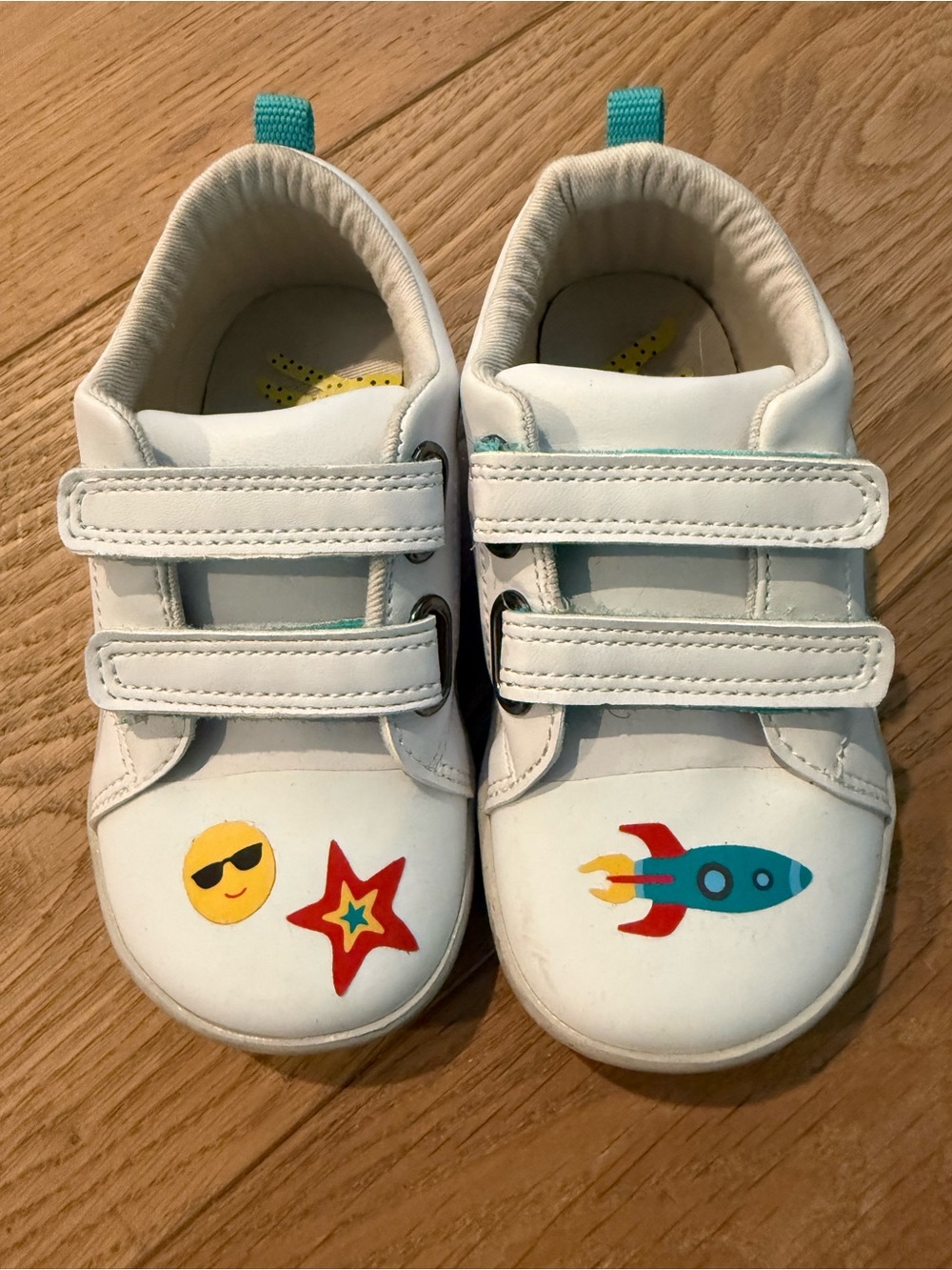 Ten Little White Velcro Sneakers with custom stickers